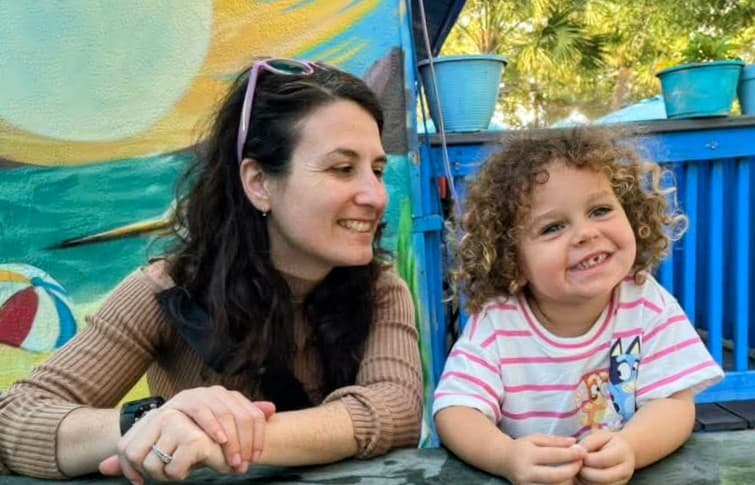 Rachel sharing a playful moment with a child